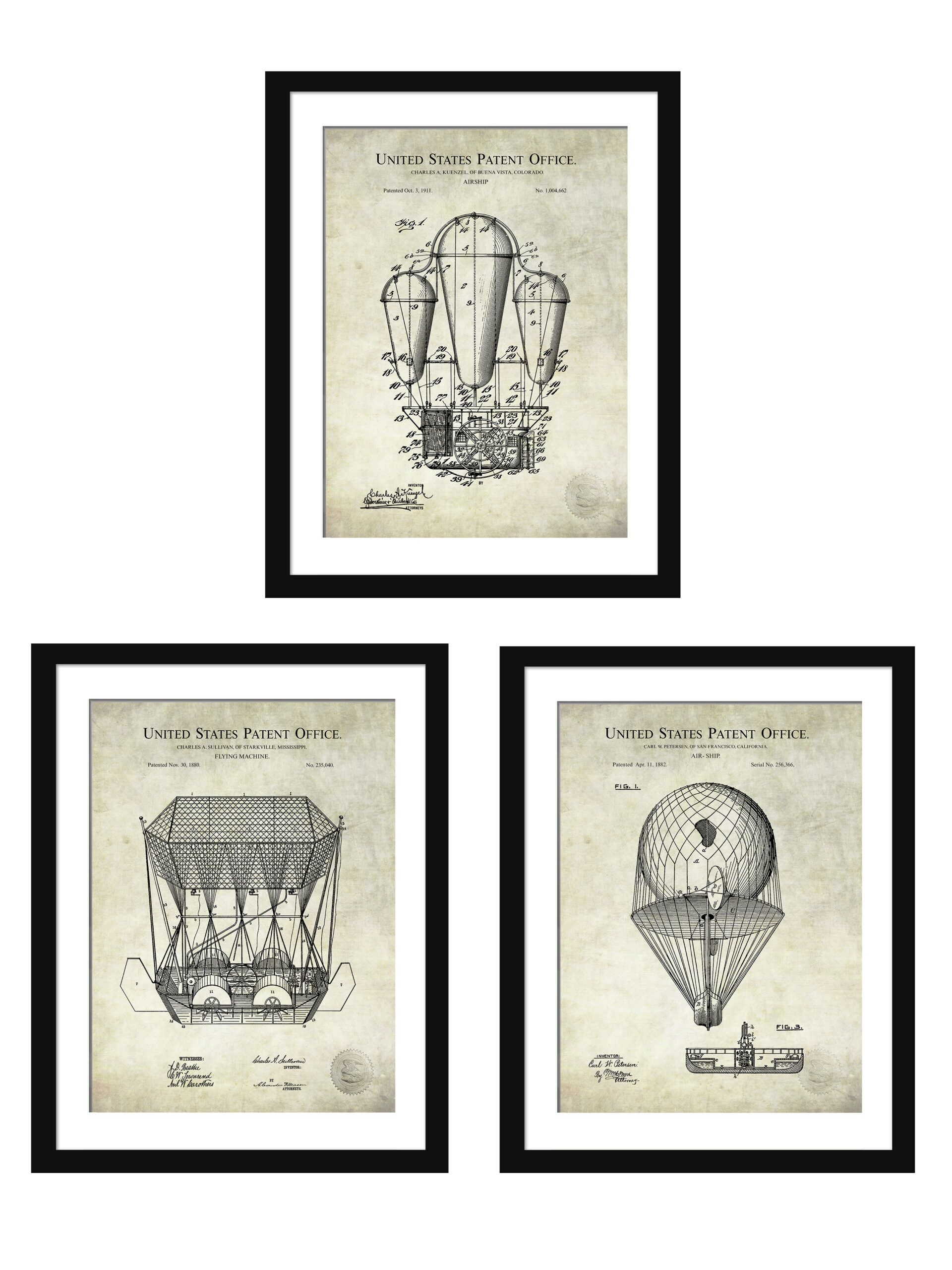 Set of three vintage airship patent prints framed on a wall.